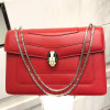 Women Red leather bag with a modern design